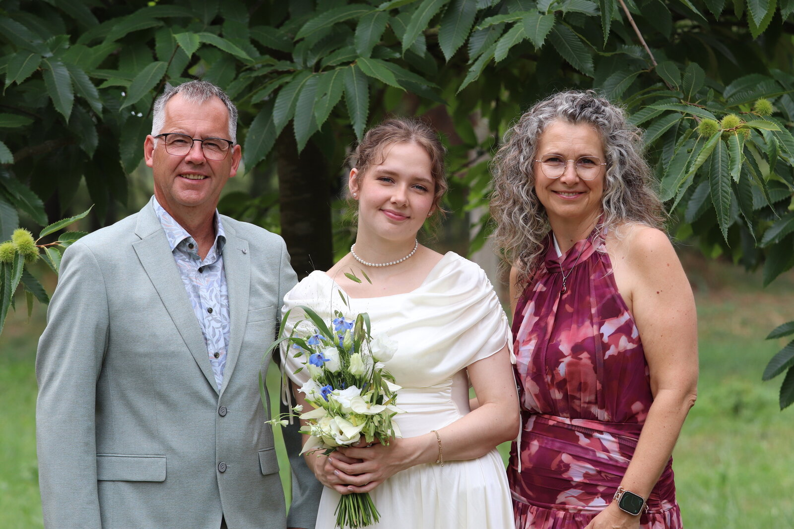 Vanessa standing with loved ones in the garden