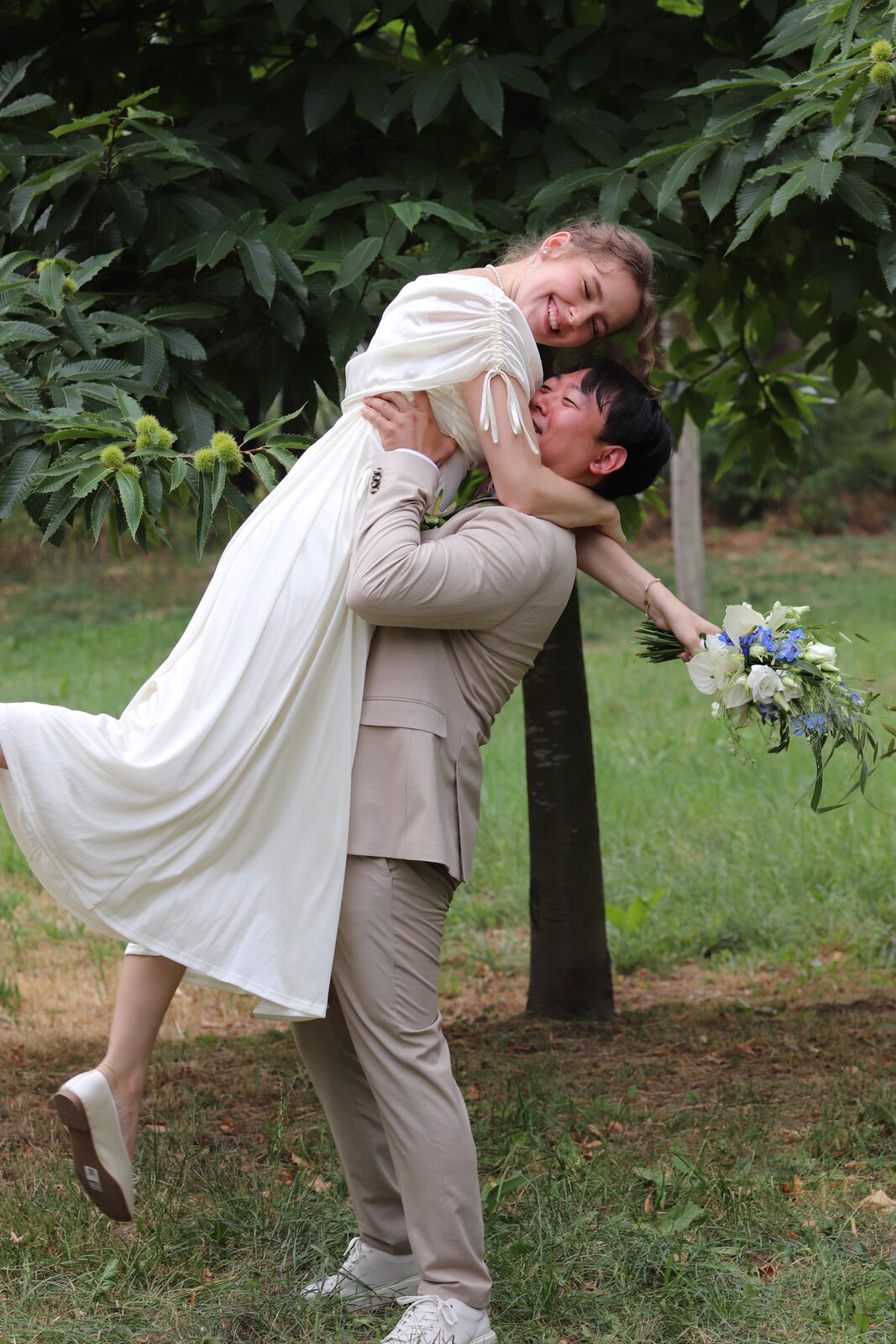 Yongjai lifting Vanessa into his arms in the garden